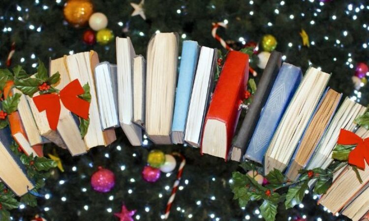 decorative graphic of a stack of books and festive baubles around