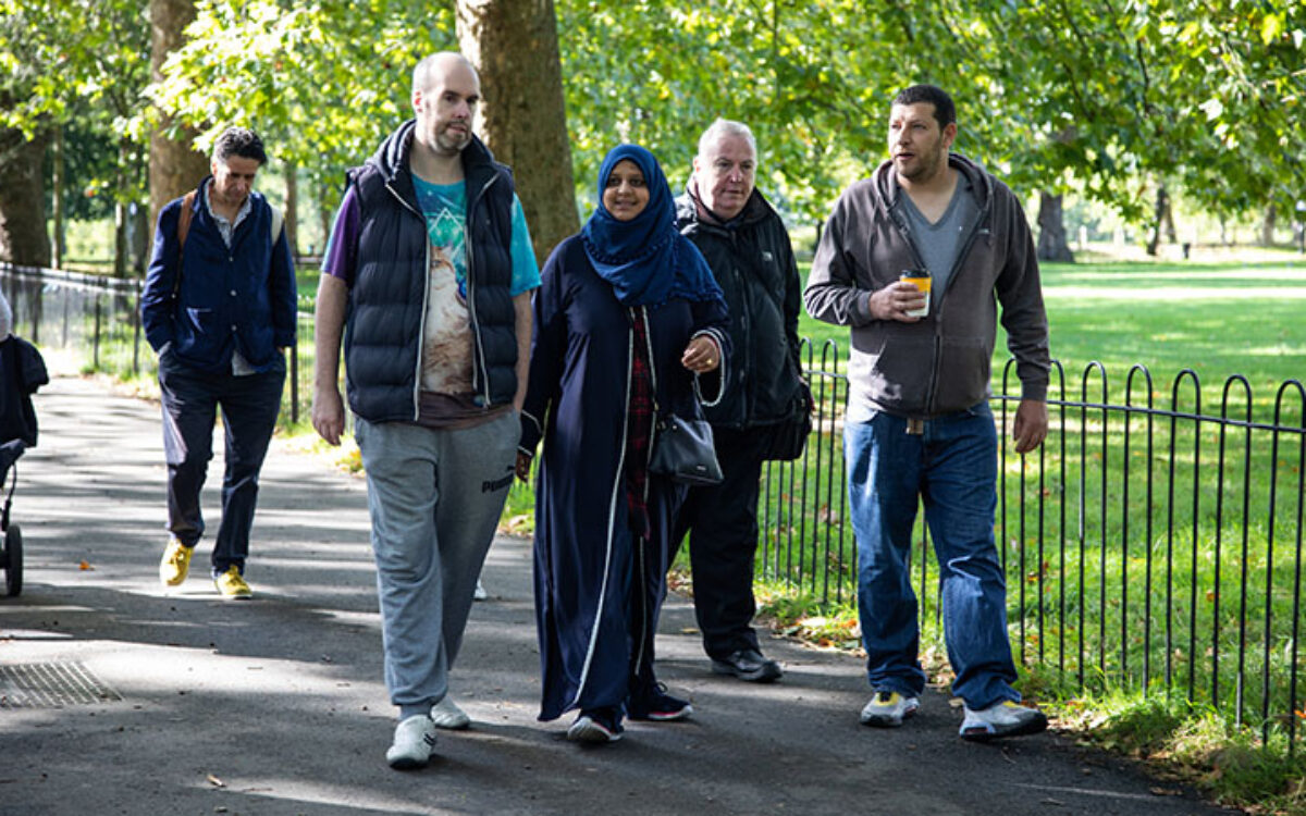 People enjoyhing a Mencap walk for people with learning disabilities on Highbury Fields
