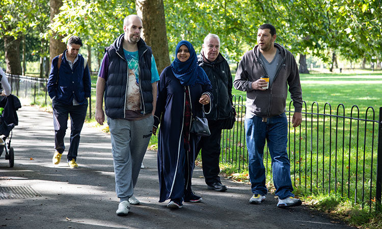 People enjoyhing a Mencap walk for people with learning disabilities on Highbury Fields