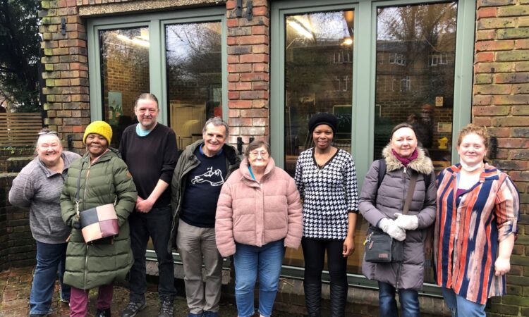 Councillors and Caxton House Community Centre Attendees celebrate the completion of the new windows at the centre.