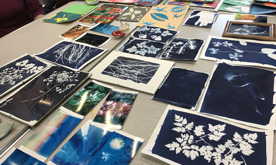 Art prints laid out on a table