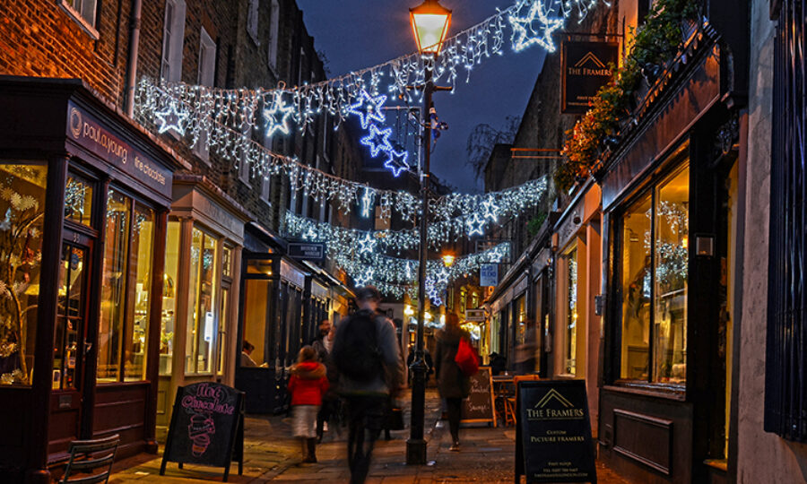 Camden Passage in the dark, lit up with Christmas lights