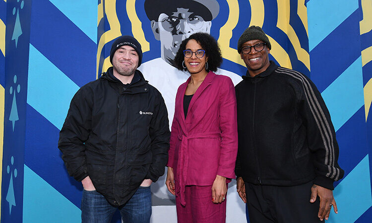 Cllr Kaya Comer-Schwartz with Ian Wright infront of the Ian Wright painting on theNo More Red Mural