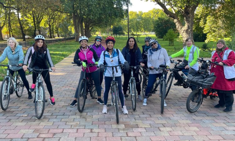 A group of women cyclists in a park