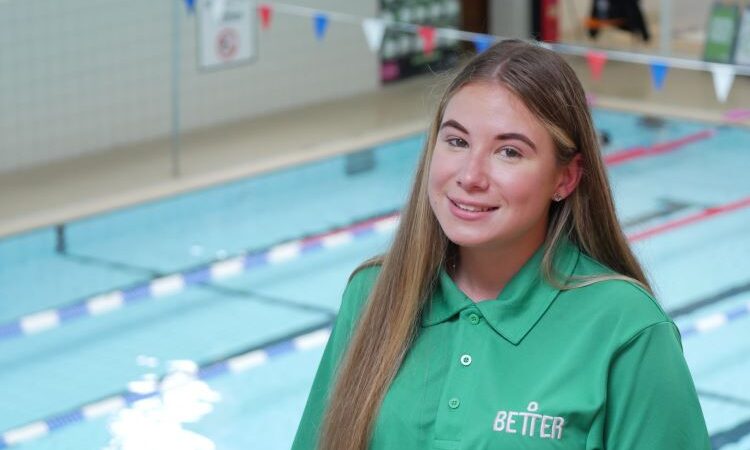 Mia Bassett lifeguard at Better gyms in front of a swimming pool