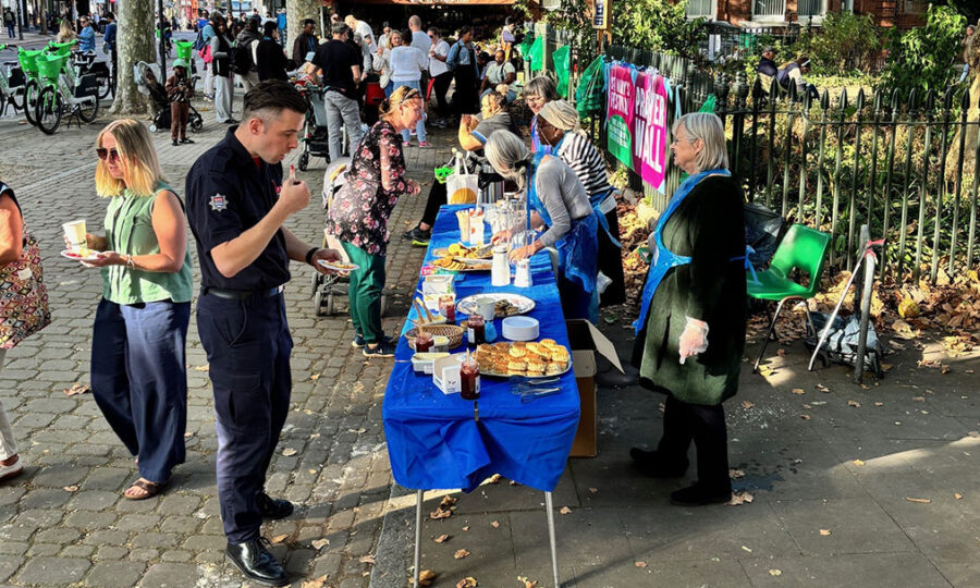 Groups of people gathered in front of stalls outside St Mary's church on Upper Street
