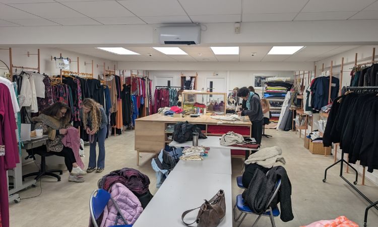 Group of people at sewing workshop