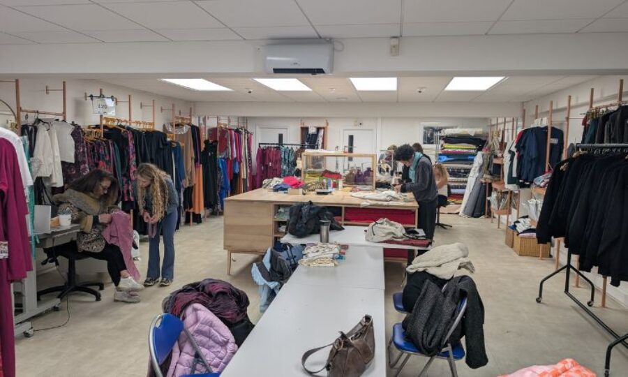 Group of people at sewing workshop